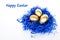 Golden easter eggs in a nest on a white background. Decorative easter decorations. Easter card. Close-up.