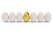 Golden egg around white eggs in row. Golden egg closeup. Golden egg as a sign of wealth, luxury. Egg as a symbol of