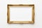 Golden Elegance: Decorative Photo Frame Adorning a Crisp White Wall