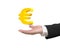 Golden euro sign in man\'s hand