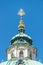 Golden Eye of Providence at the dome roof of St. Nicholas Church in Prague, Czech Republic blue sky, summer