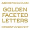 Golden faceted capital letters. Trendy and stylish font. Isolate