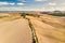 Golden Fields of Tuscany and Road Lined with Tuscan Cypress