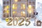 Golden figures number 2025, key and tiny home on background of cozy windows of a house with warm light with festive decor of stars