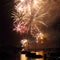 Golden fireworks over harbor landscape in Sydney night scene