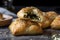 Golden flaky bourekas stuffed with spinach and feta cheese, with steam rising from the center