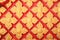 Golden Floral pattern on red wall