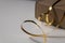 Golden foil ribbon with closed cupboard giftbox on the background - Image