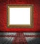 Golden frame on red plaster background