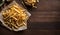 Golden French Fries Piled on Rustic Wooden Table, Copy Space