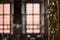 Golden fresco ornamental head on a door in a noble room