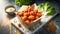 Golden fried chicken bites served with dipping sauce and salad