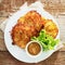 Golden fried potato fritters with mustard