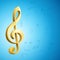 Golden g clef musical key and notes over blue background