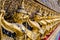 Golden garuda pattern standing at wat pha kaew