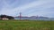 Golden Gate Bridge above the grass with fog moving over shot wider angle
