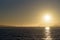 Golden Gate bridge in San Francisco, seen from the bay during hazy sunset