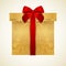 Golden gift box with red bow (ribbon). Present