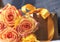 Golden gift pack,orange rose flowers and yellow decorative ribbon