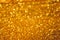 Golden glitter shiny background. Gold sparkles texture