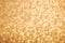 Golden glitter texture. Christmas expensive abstract background. Blured bokeh.