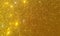 Golden glitter textured background,Bright beautiful shining golden glitter.