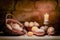 Golden Glow: Easter Vigil. A basket with easter eggs, candle, stone background