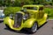 Golden green hot rod car