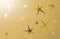 Golden grungy background with five pointed stars