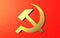 Golden hammer and sickle on a red background.