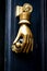 Golden hand holding a door knob