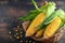 A golden harvest isolated corn on a textured wooden background