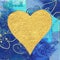 Golden heart on blue background