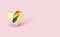 Golden heart pin with rainbow lightning inside. LGBT love and fight for their rights symbol concept. Isolated on pastel pink