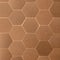 Golden, hexagonal shaped wall tiles, close-up