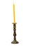 golden holder with yellow candle isolaated