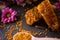 Golden honeycombs and pollen on table