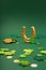 Golden Horseshoe, Gold Coins and Clover Leaves Shamrocks on Green Background for St Patricks Day Concept