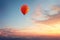 Golden Hour Ascent:Balloon Soars Against the Sunset Sky, a Captivating Display of Tranquil Adventure