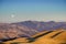 Golden hour and full moon rising over the hills and valleys of Ohlone Regional Wilderness