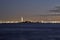 Golden hour night photography of the Verrazano Narrows Bridge, New York harbor, statue of Liberty seen from the Battery Park NYC