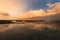 Golden hour reflections of a boat at low tide on the west coast of Taiwan