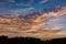 Golden hour Sun set in the evening reflecting orange on the clouds, nature background