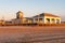 Golden hour sunrise on the beach pavilion and boardwalk from the beach