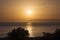 Golden hour sunset in the magical island of Patmos, Greece over a seascape and a horizon in summer time