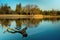 A golden hour sunset on a small lake