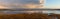 Golden hour view over the reeds of the Skern area of Northam Burrows, near Appledore, North Devon. Panorama.