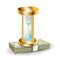 Golden hourglass on money stack