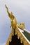 Golden Hussadeeling Statues gable apex with sky