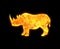 Golden icon of a rhinoceros isolated on a black background